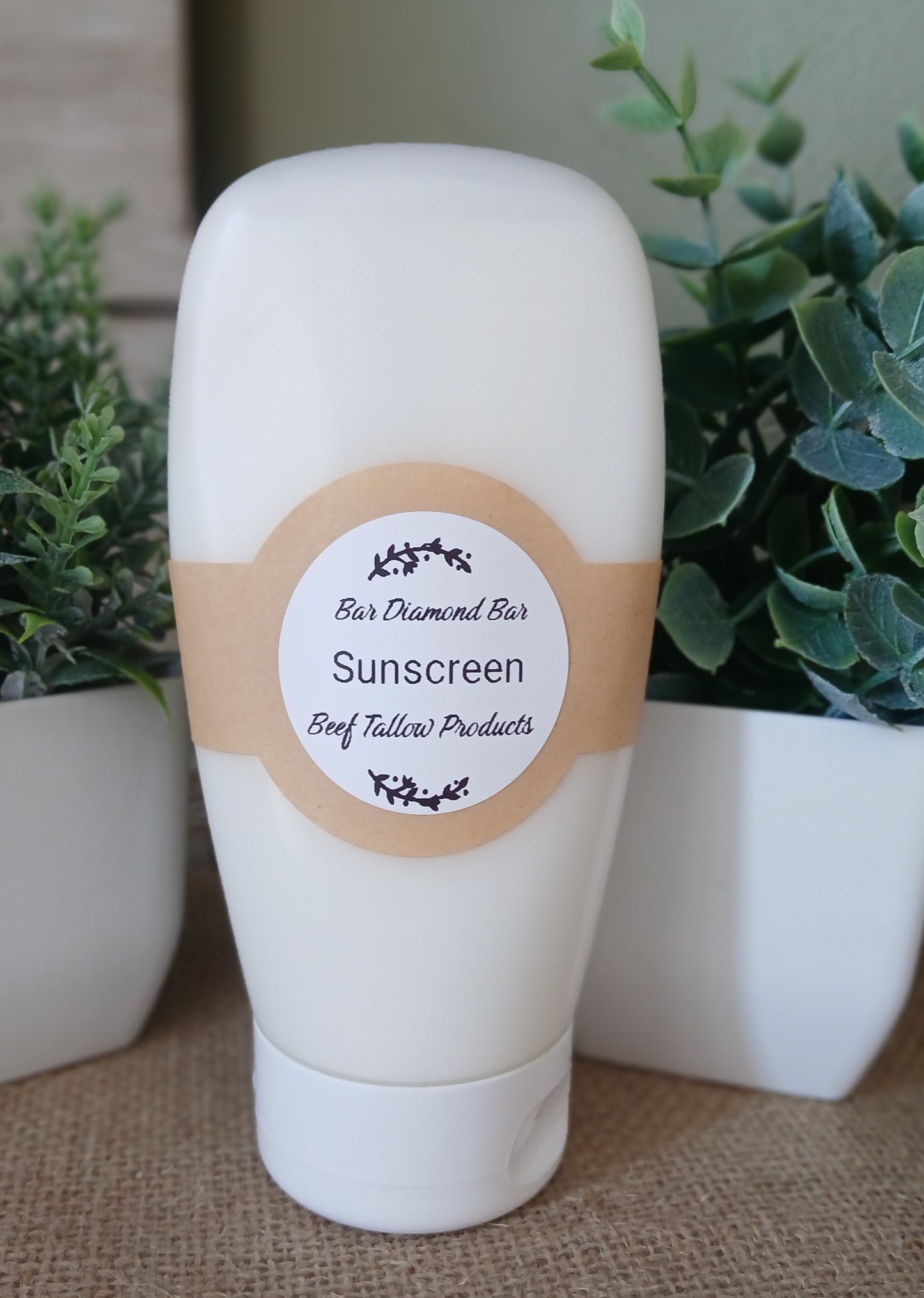 Beef Tallow Sunscreen bottle with a Bar Diamond Bar Logo
